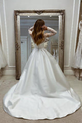 Enchanting Long A-line White Satin Wedding Dress with Long Sleeves and Split