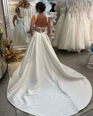 Graceful Long Ivory A-line Straps Satin Sleeveless Backless Wedding Dress With Slit